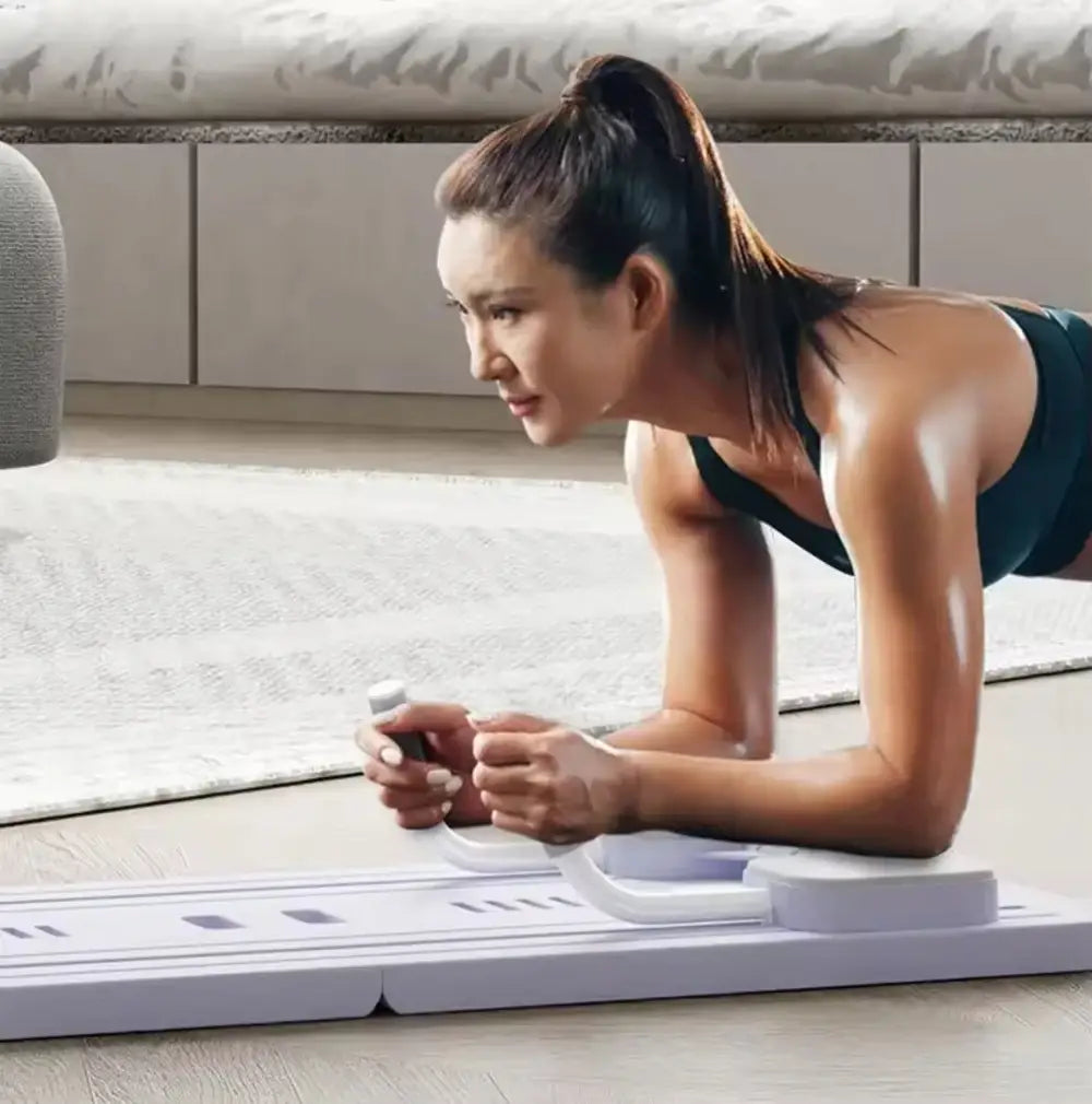 Woman in plank on exercise mat using smartphone with 4-in-1 Multi-Purpose Fitness Board.