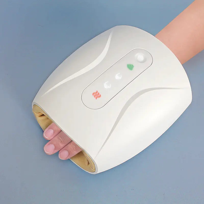 Handheld UV nail lamp for curing gel polish next to Electric Hand Massager device.