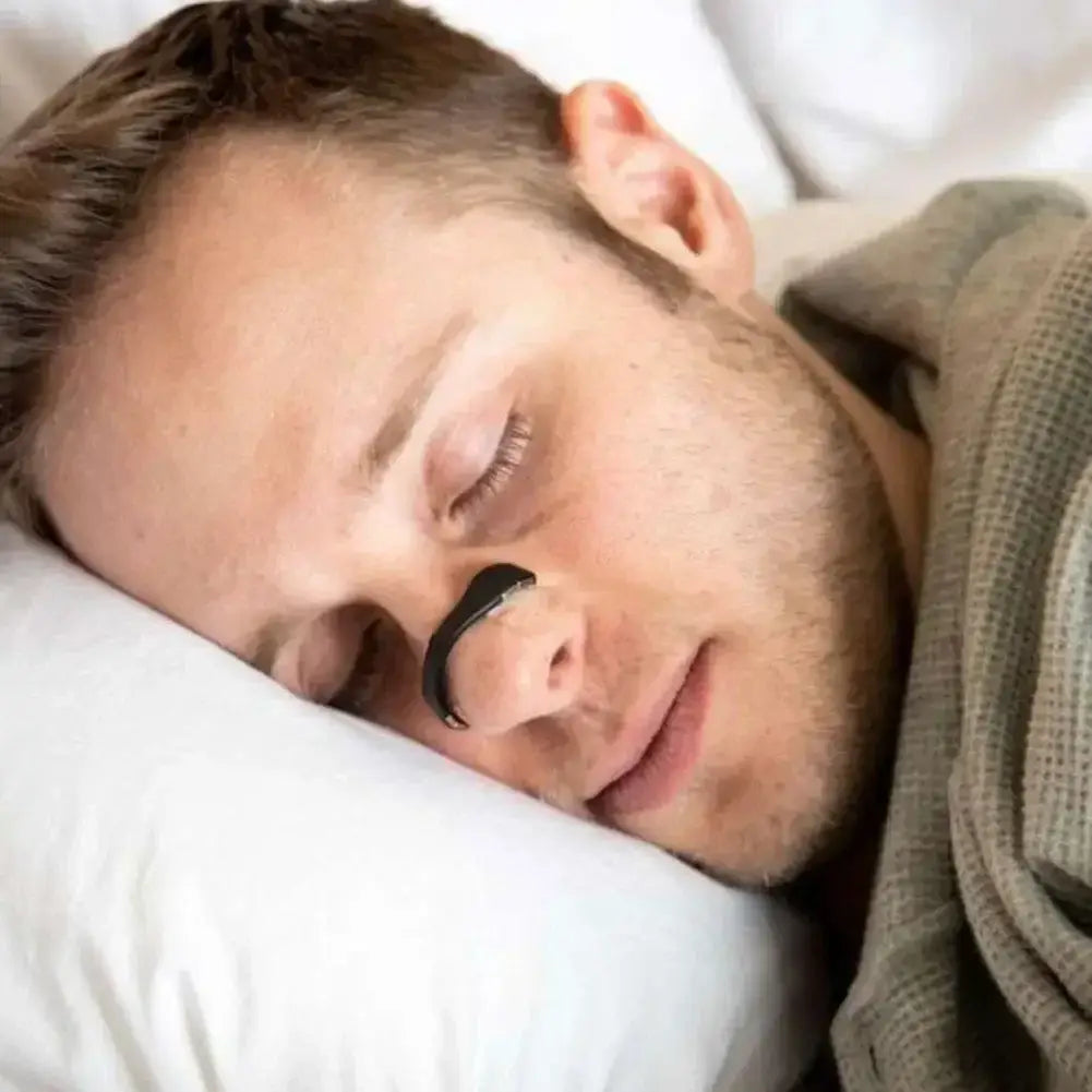 Sleeping person with a beard using Magnetic Nasal Strips to enhance sleep quality.