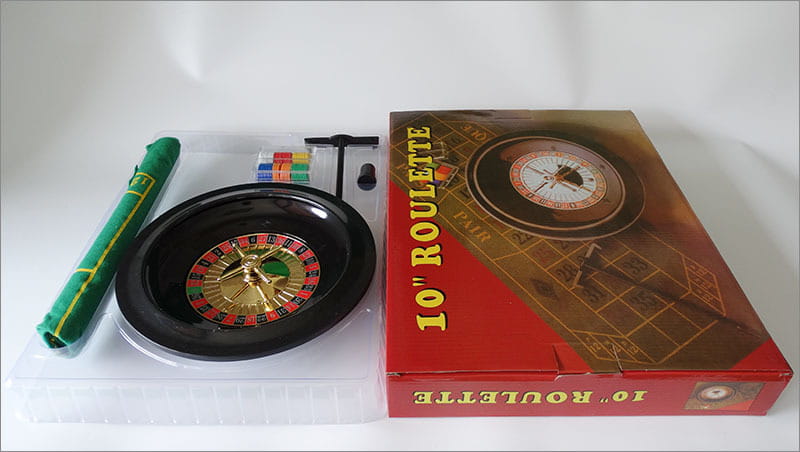 10 Inch Roulette Set Game with Wheel, Chips, Box, and Green Pen on Tablecloth