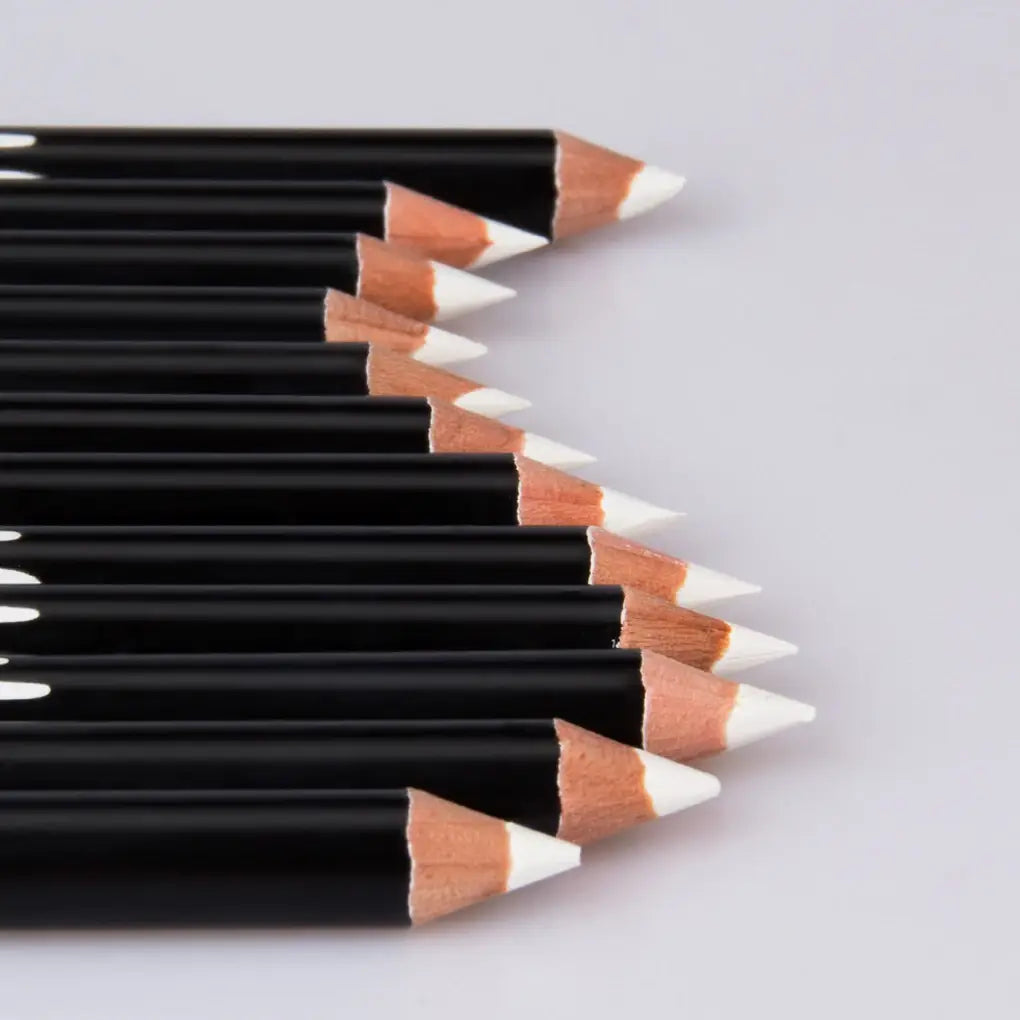 Group of black colored pencils with white tips for 12pcs long-lasting waterproof white eyeliner.