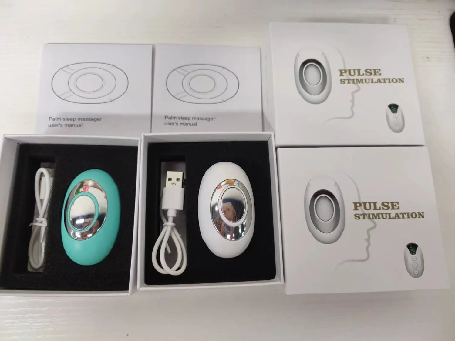 Microcurrent pulse massage device packaging with USB cables and product diagrams.