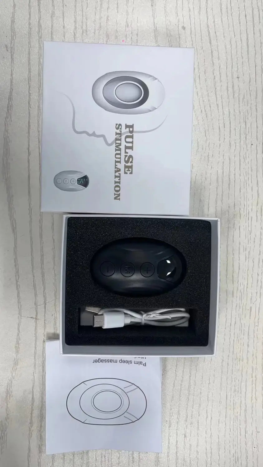 Sleek black wireless earbuds with cable and manual in Microcurrent Pulse Massage Device box.